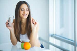 Woman Taking Dietary Supplement