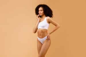 Woman with beautifully sculpted body after VASER liposuction.