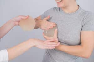 Woman meeting with doctor to discuss getting implants and a breast lift at the same time