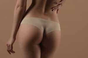 Woman with curvy buttocks after BBL procedure.