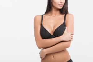 Woman with toned abdomen after contouring procedure
